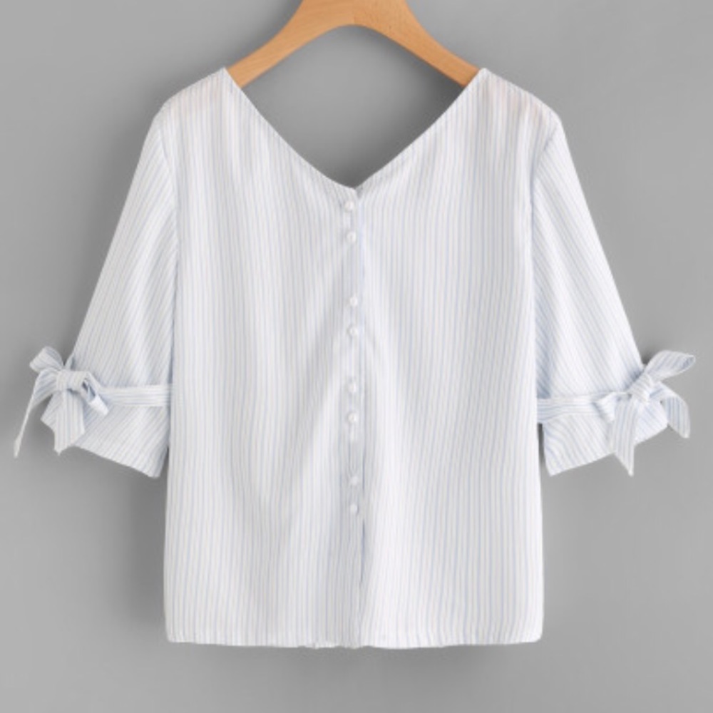 NWOT Thin blouse with ties on sleeves and on back.